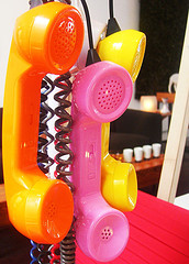 three-old-time-phones-yellow-pink-orange